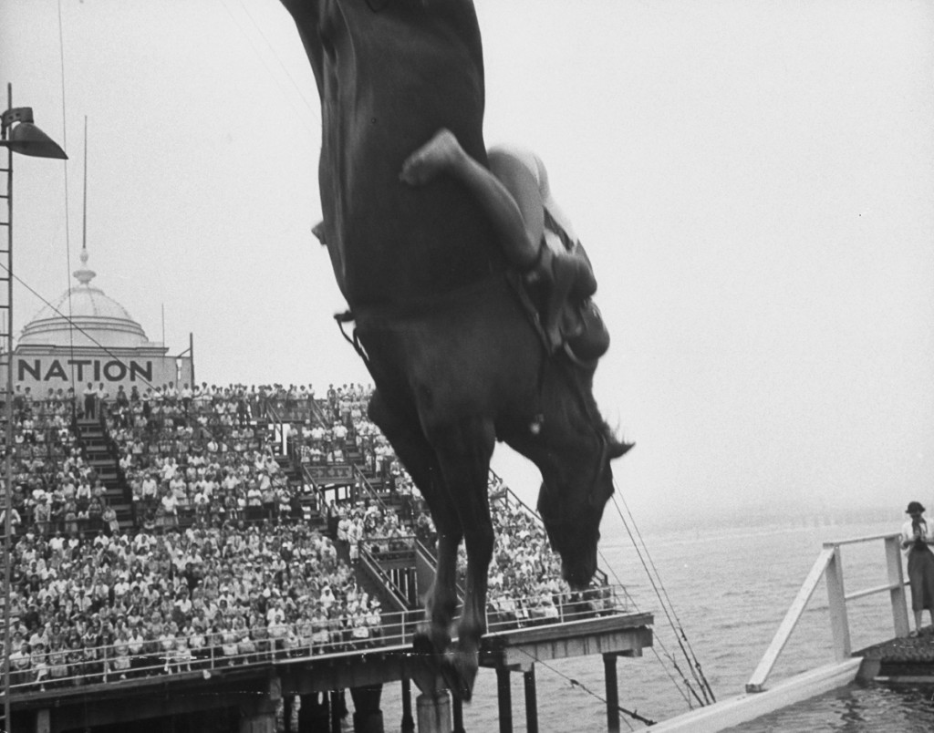 People come out to see the diving horse.  (Photo by Peter Stackpole/The LIFE Picture Collection/Getty Images)
