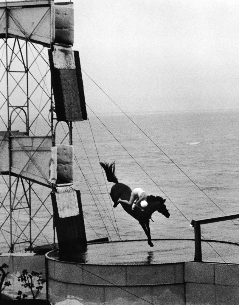 A rider on horseback performs a stunt high-dive into a swimming pool, 1940s. (Photo by Frederic Lewis/Getty Images)